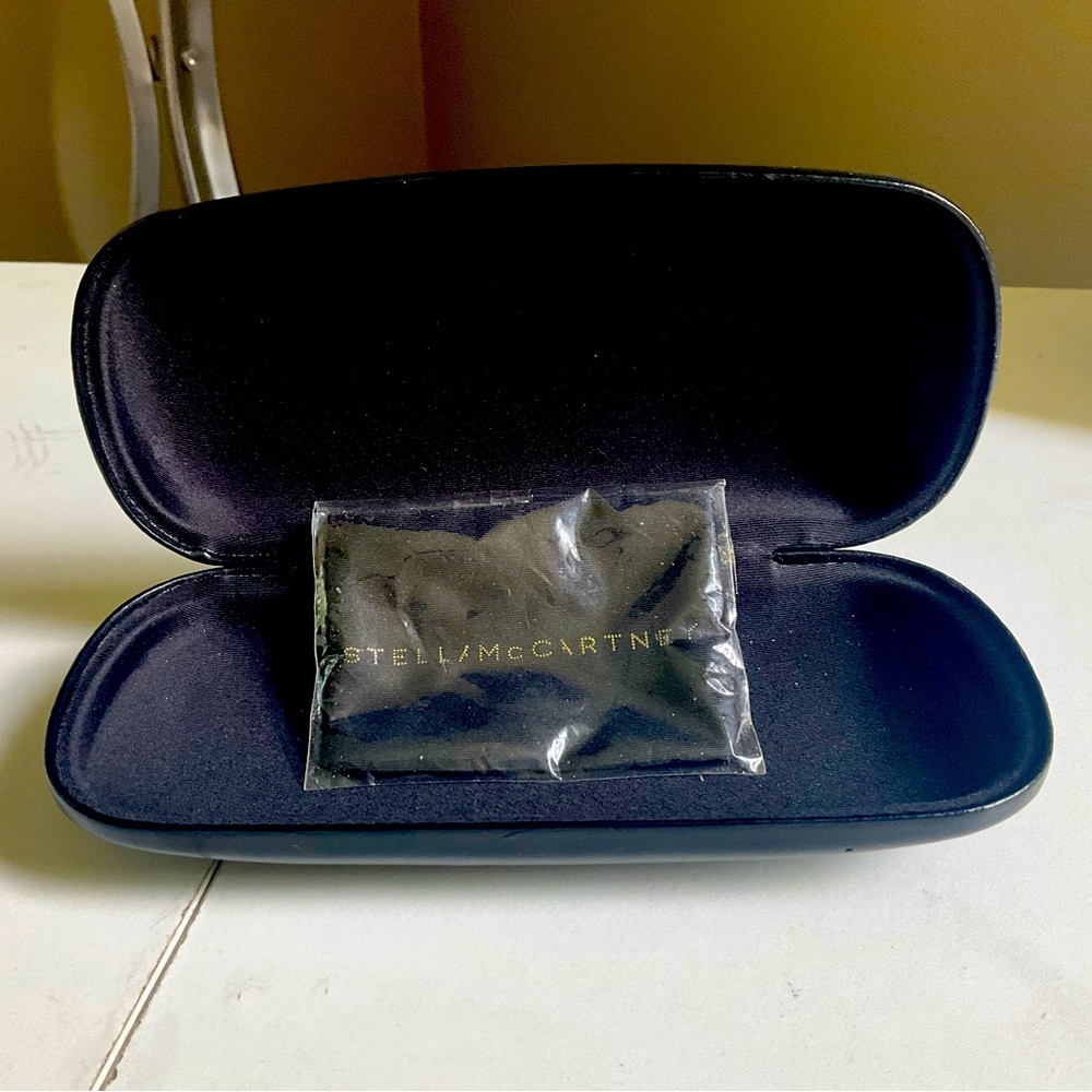 Stella McCartney glasses or sunglasses case included with branded cleaning cloth